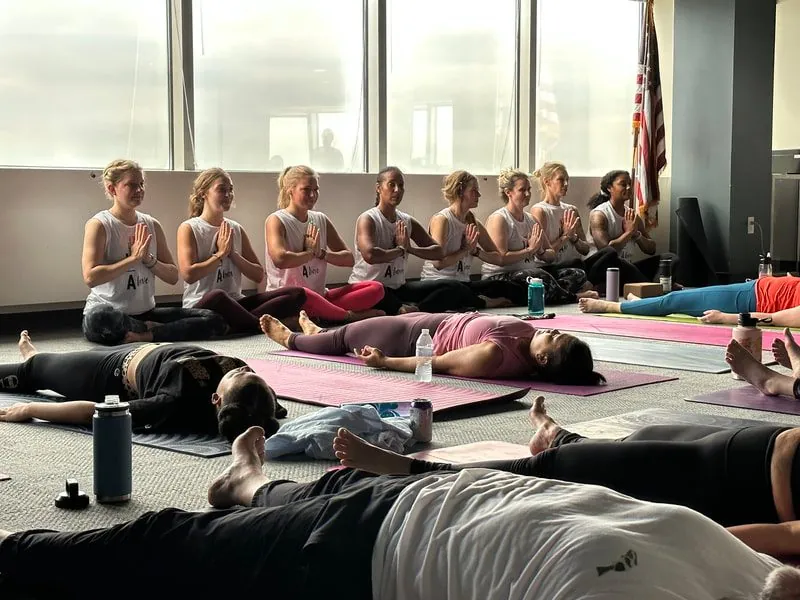 A class resting in savasana